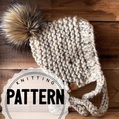 a knitted hat with a pom - pom on top and the knitting pattern below it