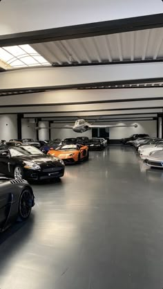 there are many cars parked in the garage