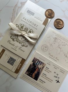 the wedding stationery is laid out on top of each other, with two different stamps