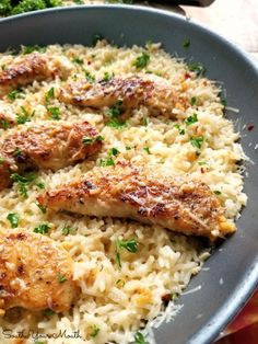 chicken and rice in a pan with broccoli on the side, ready to be eaten