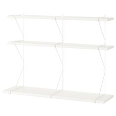 three white shelving shelves on each side