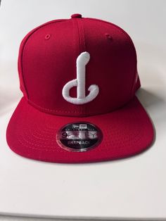 "-Upside Down \"P\" -New Era 9Fifty Snap Back Hat -color: Red (White Thread)" Affordable Red Fun Snapback Hat, Red Snapback Flat Cap For Sports, Red Flat Crown Baseball Cap For Baseball Season, Red Fitted Hat For Sports With Flat Crown, Red Fitted Hat With Flat Crown For Sports, Red Fitted Hat For Baseball With Flat Crown, Red Fitted Hat For Baseball Season, Red Snapback Hat With Embroidered Logo, Casual Red Baseball Cap With Flat Crown