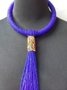 African beaded necklace made with the royal blue beads. Its a perfect accessory that will match most of your outfits. Suitable for any season. A good gift to your friends and loved ones. Blue Bohemian Necklaces For Party, Blue Beaded Chain Necklace For Party, Blue Round Beads Necklaces For Party, Blue Round Bead Necklaces For Parties, Blue Long Necklace For Party, Elegant Blue Necklaces With Dangling Beads, Blue Necklaces With Colorful Beads For Party, Elegant Blue Beaded Necklaces With Large Beads, Party Necklaces With Colorful Blue Beads