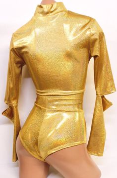 Check out our robot love with a set for our favorite android! Our Golden Space Droid set has a Long Sleeve Keyhole Crop Top in gold hologram with cut outs on the elbows for a futuristic look. The bottoms super cheeky with a lining in the front panel. Made of 4 way stretch lycra.ALL HANDMADE IN USA Items will ship within 2-4 business days. Sugarpuss Size Chart + Care Instructions Shipping Policies Fitted Shiny Gold Bottoms, Gold Fitted Bottoms For Club, Gold Fitted Bottoms For Club Wear, Fitted Gold Bottoms For Club Wear, Metallic Rave Bottoms For Party, Metallic Rave Party Bottoms, Pin Up Costume, Hoodie Costume, Cheeky Shorts