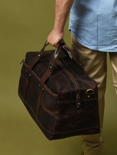 Here is the perfect blend of sophistication and style with our unique leather duffle bag in a rich, textured coffee bean hue, accented by sleek black handles. The full-grain buffalo leather adds to the endurance yes well as the charm of the duffle bag. Best for short trips and routine journeys. Elevate your travel game with this distinctive accessory today! Salient Features Made of grain buffalo leather Pure brass hardware with bottom studs to protect the bag Adjustable leather shoulder strap with padding Consists of a large central compartment with one front zipped pocket for easy access. Can be used as a carry-on bag on airplanes Size Available 20 L x 9 H x 8 W Inches / 48.26 L x 22.86 H x 20.32 W Cms Brown Leather-lined Luggage For Travel, Brown Leather Lined Travel Bag, Rugged Large Capacity Duffle Bag For Travel, Brown Business Weekender Bag With Luggage Sleeve, Brown Leather Lining Duffle Bag For Travel, Rugged Brown Duffle Bag With Large Capacity, Rugged Brown Travel Bag With Large Capacity, Rugged Large Capacity Brown Travel Bag, Brown Leather Luggage For Overnight Trips