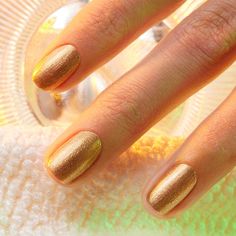 A honey-glazed bronze with cool undertones nail polish from the Green™ () range. Subtle, golden and spangled with stars, this glitter polish can party for hours.