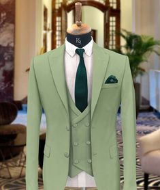 "Men Suits, Suits For men light green three piece Wedding Suit, Formal Fashion Slim Fit Tuxedo Suit  COMPULSARY  PLEASE MEASURE YOUR CHEST AREA, CIRCUMFRENECE AROUND THE BROADEST PART OF CHEST AND WAIST AREA WHERE YOU NORMALLY WEAR YOUR TROUSER OR 4 FINGER BELOW THE BELLY BUTTON, AND PICK YOUR SIZE ACCORDINGLY  PLEASE PROVIDE YOUR HEIGHT AND WEIGHT IN THE PERSONALISATION BOX , WHILE PLACING THE ORDER PLEASE CHECK THE SIZE CHART BEFORE PLACING THE ORDER IN SIZE CHART , \"WAIST\" REFERS TO THE AREA WHERE YOU NORMALLY WEAR YOUR TROUSERS. This Elegant Fashion 3 piece suit With Matching Vest And Trousers for Men Is Perfect For every one Who Loves formal Suits. This Designer Suit will be Handcrafted Specially For You only after You Place an Order. Fabric:- Terry Rayon Premium Includes:- Coat Ves Till Green Color, Light Green Tuxedo For Men, Fitted Green Three-piece Suit For Groom, Green Notch Lapel Three-piece Suit For Wedding, Green Fitted Three-piece Suit For Groom, Fitted Green Three-piece Suit For Grooms, Elegant Green Three-piece Groom's Suit, Elegant Green Three-piece Suit For Groom, Fitted Green Tuxedo For Groom