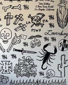 black and white wall with various tattoos on it