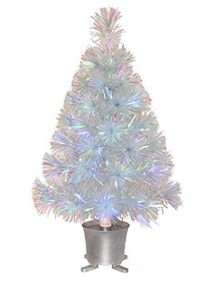 a white artificial christmas tree in a pot on a white background with the lights turned on