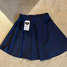 Navy Blue Tennis Skirt Never Worn Stretchy Waist Band Blue Stretch Mini Pleated Skirt, Blue Stretch Pleated Mini Skirt, Blue Pleated Flared Tennis Skirt, High Waist Blue Flowy Skort, Blue High-waisted Flowy Skort, High-waisted Blue Flowy Skort, Blue Pleated Flared Skort, Blue Lined Flared Tennis Skirt, Blue Pleated Flared Mini Skirt