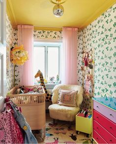 an instagram page with a baby's room decorated in pastel colors and floral wallpaper