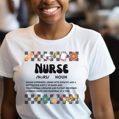 If you are looking for the perfect shirt to stand out and describe your profession in a cute, funny way then look no further! Inject some humor into your scrubs rotation with our Retro Nurse Definition Shirt! This groovy t-shirt is perfect for nurses who embrace the challenges of their profession with a smile and a sense of humor. Featuring a quirky definition of a nurse, this shirt is a fun and stylish way to celebrate the hard work and dedication of healthcare heroes. SIZING: .UNISEX Jersey Short Sleeve Tee - soft cotton ribbed knit collar, tapered shoulders, dual side seams. Please refer to the SIZE CHART provided in the listing photos for detailed sizing information. SHIRT & INK COLORS: Colors for the text & design and/or color of the shirts/sweatshirts may vary slightly from the photo Nurse Definition Shirt, White Nursing T-shirt With Letter Print, White Letter Print T-shirt For Nursing, Nursing Cotton T-shirt With Letter Print, Nurse Definition, Nursing Humor, Healthcare Heroes, Definition Shirt, Vintage Nurse