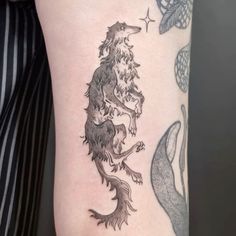 a woman's arm with a tattoo on it