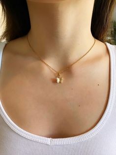 Stunning Dainty Gold Butterfly Necklace. Contains a 24k Plated gold butterfly pendant, and a gold plated chain. Great for everyday wear, special occasions, or as a gift.  ♥ Length 14" - 18" ♥ Pendant 1/2" x 3/8" ♥ Gold plated over brass ♥Matching Earrings: https://www.etsy.com/listing/853039038/24k-gold-plated-butterfly-earrings-hoop?ref=shop_home_active_11 ♥MATERIAL: -16K gold plated over brass Plated jewelry is a wonderful, affordable way to add a sophisticated look to your wardrobe, with the Elegant Gold Butterfly Charm Necklace, Butterfly Necklace With Adjustable Chain For Gift, Gold Butterfly Necklace For Everyday Wear, Everyday Gold Necklace With Butterfly Charm, Everyday Gold Butterfly Necklace, Gold Plated Butterfly Charm Pendant Necklace, Dainty Gold-plated Necklace With Butterfly Charm, Gold Plated Butterfly Necklace As Gift, Gold Necklace With Butterfly Charm As Gift