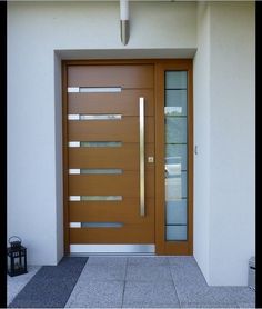 the front door to a house with glass panels