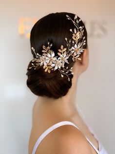 a woman wearing a hair comb with flowers on it