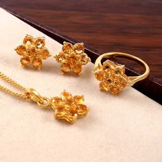 This Sterling Silver Jewelry set features an Elegant Art With Natural Citrine Gemstone. The cavity is made from genuine solid 925/92.5 Sterling silver with 18k Gold Plating and stamped as S925. This Jewelry is Lead free. ITEM DESCRIPTION Item Code: JACBS25/47 Metal: 18k Gold / Rose Gold Plated over 925/92.5 Sterling Silver Gemstone: Genuine Natural Citrine Gemstone Shape: Round Gemstone Size:  5, 4 MM Ring Dimension:- Length: 14.5 MM Width:  14.5MM Weight: 3.17 gm approx  Earrings Dimension:- Length: 14.5 MM Width:  14.5 MM Weight: 3.18 gm approx  Pendant Dimension:- Length: 14.5 MM width:  14.5 MM Weight: 1.82 gm approx  Chain Length: 14 inches, 16 Inches, 18 Inches, 20 inches and 22 inches Our Jewelry comes with 1 Micron thick Solid Gold Plating over 925 Sterling Silver, which is far bet Fine Jewelry Citrine With Polished Finish, Elegant Citrine Jewelry With Prong Setting, Fine Jewelry With Polished Topaz, Citrine Jewelry With Polished Finish For Anniversary, Fine Jewelry In Polished Topaz, Polished Topaz Fine Jewelry, Anniversary Jewelry With 17 Jewels And Citrine, Anniversary Citrine Jewelry With Polished Finish, Formal Yellow Gold Gemstone Jewelry Sets