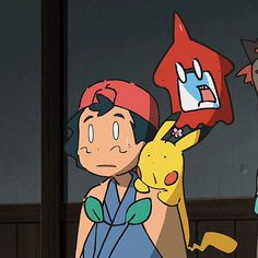 two cartoon characters are standing next to each other and one is holding a pikachu