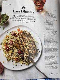 a magazine about grilled swordfish with couscous and tomatoes