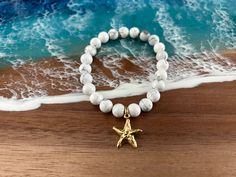 ENJOY FREE FIRST CLASS DOMESTIC SHIPPING ON THIS ITEM! Perfect gift for anyone who loves the beach, starfish, and beautiful gemstones!  1 Bracelet:  Stretch/Elastic - Bracelet:  8mm White Howlite Gemstone Beads - Charm:  12k Antiqued Gold Starfish Charm, approximately 17 x 20mm - PLEASE NOTE:  Bracelet fits a standard (medium wrist)  Each design is presented in a pretty organza pouch Thank you for visiting my shop! White Beaded Bracelet With Starfish Charm As Gift, Adjustable Stretch Bracelet With Star Charm As Gift, Gold Spiritual Stretch Bracelet For Beach, Gold Beaded Bracelets With Starfish Charm As Gift, Starfish Charm Bracelet As Gift, Adjustable White Beaded Bracelet With Starfish Charm, Gold Bracelets With 8mm Beads For Beach, Adjustable Starfish Charm Bracelet Gift, Adjustable White Charm Bracelet With Star Charm