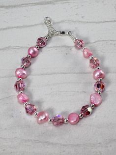 Such a great gift for any little girl who loves pink. This lovely bracelet is made with swarovski crystals,fresh water pearls and delicate sterling silver beads. Shipped in a chiffon gift bag ready for gifting. The perfect gift for a special little girl. Pink Hypoallergenic Sterling Silver Bracelets, Pink Hypoallergenic Sterling Silver Bracelet, Hypoallergenic Pink Sterling Silver Bracelets, Nickel-free Pink Bracelets For Mother's Day, Nickel Free Pink Bracelets For Mother's Day, Pink Pearl Beaded Bracelet For Birthday, Pink Pearl Bracelet For Birthday, Pink Beaded Sterling Silver Bracelets, Pink Adjustable Pearl Bracelet For Mother's Day