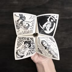 someone is holding four cards in their hand, each with an image of the same person on them