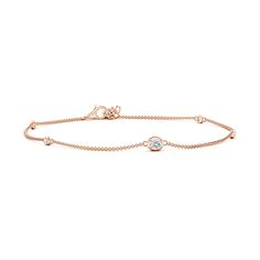 The oval diamond is accompanied by bezel-set station round diamonds on this simple and elegant 14k rose gold bracelet. It is framed by a polished metal rim that elevates the bracelet's minimalistic allure. Rose Gold Diamond Bracelet With Bezel Setting, Elegant Rose Gold Bracelet With Bezel Setting, Elegant Rose Gold Bracelets With Bezel Setting, Elegant Oval Bracelets With Bezel Setting, Rose Gold Diamond Bracelet With Bezel Setting For Anniversary, Classic Rose Gold Bracelet With Single Diamond, 14k Rose Gold Bracelet, Station Bracelet, Rose Gold Bracelet