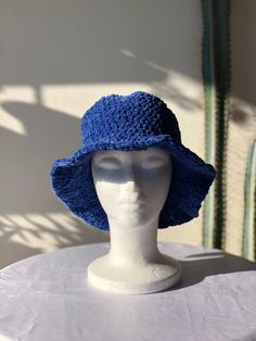 Get ready for the colder months with our chic and bold bucket hat. It's crafted from velvet fluffy yarn. ⦿ Lightweight and durable ⦿ Fluffy design ⦿ Soft top and brim Fashion bucket hat is made of velvet yarn. Soft and very comfortable It's lightweight and foldable for easy storage or for taking on the go while traveling This hat is suitable for all seasons Knitted hats are flexible and suitable for most head sizes.  Brim width: approx. 6 cm Height of crown: approx. 12 cm Avaliable in any size of colour, custom orders always welcome.  This is a great gift that can excite your family and friends and keep warm in the cold winter. If you want different color please convo me. I will do my best to assist you 👍 ★ Discover our products on: https://www.etsy.com/shop/HilenisDesign Happy Shopping H Winter Vacation Bucket Hat, Trendy Blue Flat Brim Bucket Hat, Blue Yarn Bucket Hat For Spring, Blue Knitted Hat For Spring, Blue Knitted Beach Hat, Blue One-size Spring Crochet Hat, Trendy Blue Bucket Hat For Winter, Blue Bucket Hat For Vacation, Winter Blue Bucket Hat