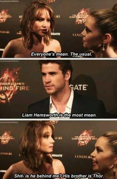 two people talking to each other in front of a red carpet with the caption'everyone's mean, the usual