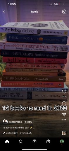 a stack of books sitting on top of each other in front of a computer screen