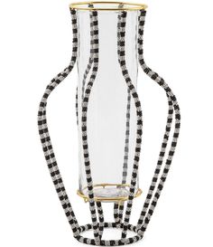 a glass vase with black and white checkered ribbon around the neck, on a white background