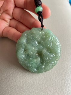 🌈 Chinese 9 Dragons Jadeite Pendant, Round Shape in Green 🌷 Untreated Natural Jadeite/ Grade A Jade 🌷 Certified : YES 🌷 Jade from Myanmar/ Burma 🌷 100% handmade carving 🌷 Chinese 9 Dragons 🌷 Dimensions : 53.8 x 53.8 x 13 mm 🌷 Color : Green 🌷 Free standard shipping from Hong Kong with tracking included 🌷 Take approximately 7-21 days to arrive worldwide 🔥 Recommended items look similar: 👍 https://www.etsy.com/listing/727799025 ❤️ In Chinese Culture: Young people wear jade pendant will Green Oval Carved Necklace, Handmade Round Green Emerald Necklace, Green Carved Amulet Necklace, Green Amulet Round Necklace, Green Amulet Style Round Necklace, Green Round Amulet Necklace, Green Carved Round Pendant Jewelry, Carved Green Round Jewelry, Green Carved Round Jewelry