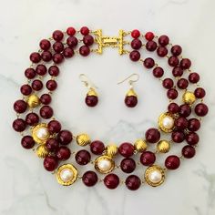 "Vintage Three Strand Baroque Cranberry Red Glass Bead And Glass Pearl Necklace. Beautiful Vintage Three Stranded Baroque Style Graduated Cranberry Red Glass Bead And Glass Pearl Necklace. Luscious Graduated Cranberry Red Glass Beads Adorn This Festive Necklace. This Pretty Piece Features Three Strands Of Graduated Glass Beads And Glass Pearls. Two Strands Are Accented With Etched Textured Round Gold Beads And Glass Pearls Set In The Center Of A Gold Plated Cut Out Frame. The Third Stand Showcas Luxury Red Necklace With Polished Beads, Elegant Red Beaded Pearl Necklace, Elegant Burgundy Beaded Necklaces With Round Beads, Elegant Red Round Pearl Necklace, Elegant Red Pearl Necklace With Gemstone Beads, Elegant Handmade Red Beads, Gems, And Cabochons, Neck Pieces Jewelry, Festival Necklace, Pearl Vintage