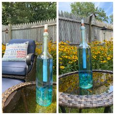 two bottles filled with blue liquid sitting on top of a table next to a chair