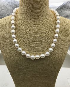 "pearl jewelry: pearl necklace Quantity: 1 pc necklace length: 17 inches pearl size: around 10mm--width pearl body: AA+ pearl grade: AA+ pearl luster: high pearl shape: rice pearl color: white Back to Other Jewelry Section 01: \"Tahitian,Akoya,Sea Pearl\" Section: https://www.etsy.com/shop/WenPearls?section_id=15806339 02: \"Potato/Near Round Pearl\" Section: https://www.etsy.com/shop/WenPearls?section_id=16378067 03: \"Round Pearl\" Section: https://www.etsy.com/shop/WenPearls?section_id=161632 White Oval Pearl Pendant Necklace, White Pearl Drop Oval Necklace, White Oval Pearl Drop Necklace, Classic White Pear-shaped Necklace, Classic White Baroque Pearl Necklace, Rice Pearl Necklace, Leather Pearl Jewelry, Jewelry Pearl Necklace, Big Pearl