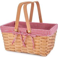 a picnic basket with a red and white gingham ribbon tied around the handle