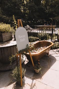 Booze bath wedding drinks station with neutral wedding signage on easel next to the bath Wedding Booze Ideas, Drink Station At Wedding, Wedding Drinks Bar, Drinks Wedding Station, Alcohol Station Wedding, Fall Wedding Drink Station, Wedding Drink Display, Bath Drinks Wedding, Drinks Station Wedding