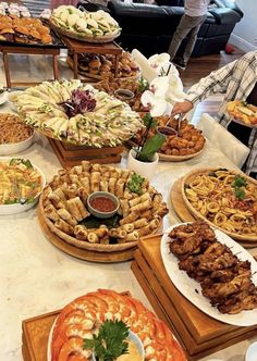 a table filled with lots of different types of food