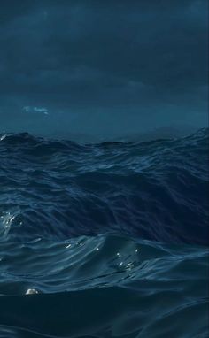 an image of the ocean at night with dark clouds and water in the foreground