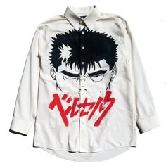 "Off-white Button down, hand-painted with the face of Guts inspired by the manga/anime Berserk. One-of-a-kind hand-painted anime-inspired designs! \"You're right, we are mortal and fragile. But even if we are tortured or wounded, we'll fight to survive. You should feel the pain we feel and understand. I am the messenger that will deliver you to that pain and understanding\" - Guts" Pop Culture Anime Print Shirt For Cosplay, Harajuku Style Screen Print Shirt For Cosplay, Casual Cosplay Shirt With Screen Print, Anime Style Long Sleeve Cosplay Top, Anime Style Long Sleeve Tops For Cosplay, Anime Cosplay Long Sleeve Top, Anime Style White Shirt With Graphic Print, Anime Style Graphic Print White Shirt, Anime Style White Graphic Print Shirt