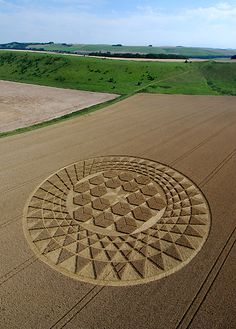 an aerial view of a field with a circular design in the middle