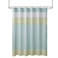 a shower curtain with blue and beige stripes on it, hanging from a metal rod