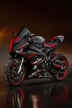 a black and red motorcycle is parked in the dark