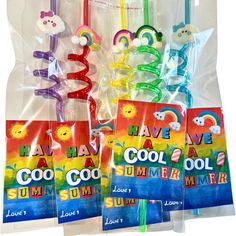 four colorful toothbrushes in plastic bags with the words have a cool summer written on them