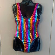 Fashion Classic Collection Shiny Metallic Rainbow Blue Pink Orange Hi Cut One Piece Swim Suit Size Xsmall 80% Nylon 20% Spandex Chest Measures 14" Across Armpit To Armpit, Length From Shoulder To Crotch 28", Nwts Metallic Stretch Swimwear For Swimming, Metallic Stretch Sleeveless Bodysuit, Metallic Sleeveless Stretch Bodysuit, Metallic Sleeveless Fitted Bodysuit, Metallic Fitted Sleeveless Bodysuit, Stretch Disco Bodysuit For Summer, Fitted Sleeveless Rave Bodysuit, Spring Rave Fitted Swimwear, Fitted Rave Swimwear For Spring