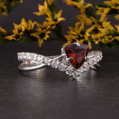 "Womens sterling silver garnet promise ring, Art deco promise ring for her,Garnet engagement ring,Trillion cut red garnet ring,Garnet jewelry WE OFFER UNLIMITED PERIOD INSTALLMENTS PLAN This is a beautiful, stunning, feminine ring that works well for all occasions, styles, and ages. You will love it! Ring information Main stone: White cubic zirconia Approximate size: 6x6x6mm Accent stones: White cubic zirconia Approximate size: 1.5mm (19 stones) Metal type: Silver Metal stamp: 925 Sterling SIlve Elegant Jewelry With Lab-created Ruby For Promise, Elegant Lab-created Ruby Jewelry For Promise, Elegant Garnet Birthstone Ring With Center Stone, Fine Jewelry Garnet Rings With Accent Stones, Elegant Garnet Ring With Center Stone, Formal Garnet Rings With Accent Stones, Elegant Promise Ring With Lab-created Ruby, Elegant Wedding Rings With Garnet, Anniversary White Gold Jewelry With Lab-created Ruby