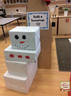 cardboard boxes stacked on top of each other in the shape of a snowman