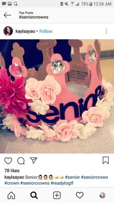 a pink crown with flowers on it sitting on top of a counter next to a tweet