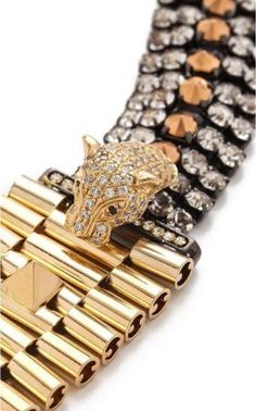 This Iosselliani bracelet bridges crystal strands to a thick band of cylinders with a cheetah head charm, detailed with eyes of black cubic zirconia.Pyramid studs lend an edgy finish.Slide-bar clasp.Gold pleated brass, black cubic zirconia.Width: 1.25" / 3cmLength: 7" / 18cmMade in Italy. Chevron Outfit, Chevron Jewelry, The Cheetah, Gucci Shop, Slide Bar, Brass Bracelet, Luxury Women Fashion, Bracelet Online, Aesthetic Collage