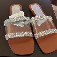 Slide Sandals In Silver. Vinyl Upper With Rhinestone Details. Squared Toe. Sole Height: 0.5 Inches (1.2 Cm) Silver | 3651/810 Zara Flat Sandals For Party, Sparkling Flat Sandals For The Beach, Zara Sandals With Rhinestones For Evening, Glamorous Clear Sandals With Rhinestones, Elegant Sparkling Beach Sandals, Zara Rhinestone Sandals For Party, Zara Sandals With Rhinestones For Parties, Chic Zara Sandals With Rhinestones, Glamorous Zara Sandals With Rhinestones